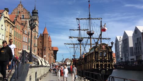 Historical-vessel-Black-Pearl-at-port-at-Stara-Motlawa-river,-Gdansk-offering-tours-for-tourists-in-sunny-summer-day