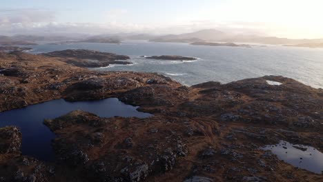 Drone-shot-of-the-seascape-and-moorland-landscape-around-Bosta-beach-in-Great-Bernera-looking-towards-Uig-and-the-Isle-of-Harris-in-the-South