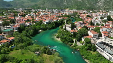 Aerial-views-of-Mostar-city-in-Bosnia-with-a-flowing-blue-river
