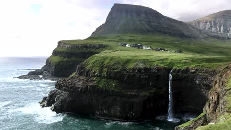 Breathtaking-landscape-scenery-of-Gásadalur-village-and-Múlafossur-waterfall-on-Vágar,-Faroe-Islands