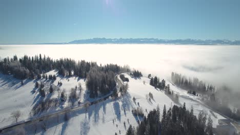 Aerial-View-of-Cars-Driving-into-Sea-of-Clouds-in-Sunny-Winter-Day,-4K-Drone-Footage