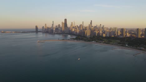 Cinematic-Establishnig-Shot-of-Chicago,-Drone-Flying-Above-Lake-Michigan