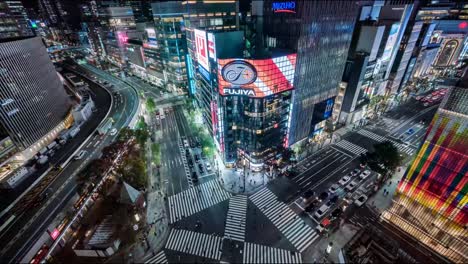 Ginza-Fujiya-traffic-Intersection-at-night,-Japan,-time-lapse