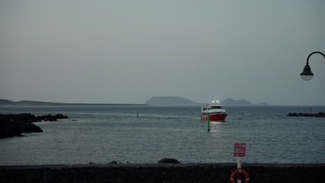 Ferry-enters-the-port-in-Lanzarote-at-dusk