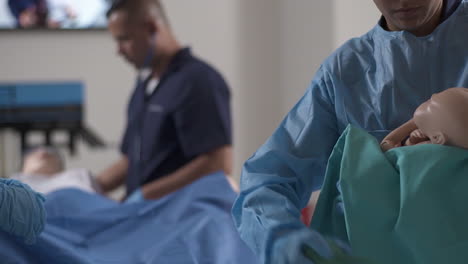 Nurse-Student-Practicing-with-Training-Mannequin