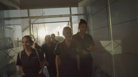 Students-Entering-Building-With-Sunset-in-the-Background