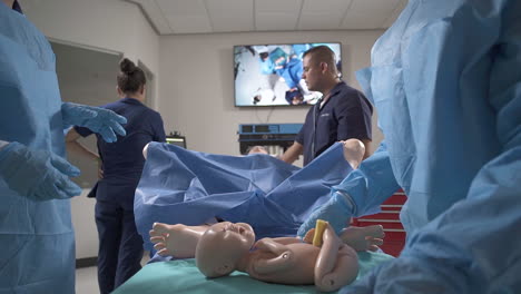 Nursing-Students-Practicing-a-Birth-Simulator