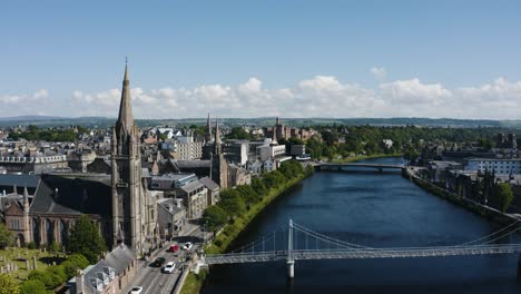 Drone-shot-of-the-River-Ness-in-Inverness,-Scotland-with-the-Greig-St-Bridge-in-the-foreground