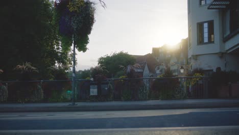 Bus-Passing-by-in-Tubingen,-Germany-in-4K-Downtown-Home-of-Europes-Oldest-University-At-Sunset
