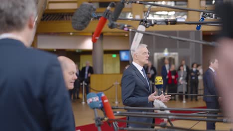 Latvian-Prime-Minister-Krišjānis-Kariņš-talking-to-the-press-in-the-European-Council-building-during-EU-summit-in-Brussels,-Belgium