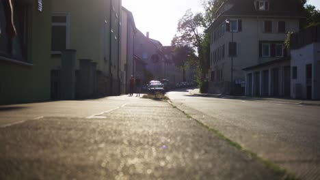 Man-Walking-Near-Church-in-Tubingen,-Germany-in-4K-Downtown-Home-of-Europes-Oldest-University-At-Sunset