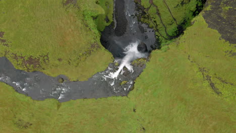 Aerial:-Rising-orbit-shot-of-Kvernufoss-waterfall-in-Iceland