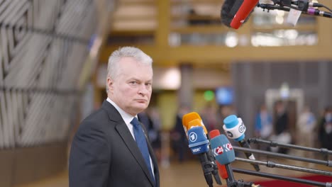 Lithuanian-President-Gitanas-Nausėda-talking-to-the-press-in-the-European-Council-building-during-EU-summit-in-Brussels,-Belgium