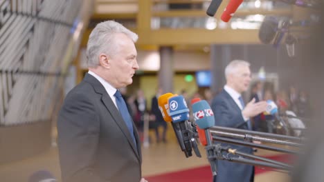 Latvian-Prime-Minister-Krišjānis-Kariņš-and-Lithuanian-President-Gitanas-Nausėda-giving-press-statement-in-the-European-Council-building-during-EU-summit-in-Brussels,-Belgium