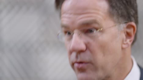 Dutch-Prime-Minister-Mark-Rutte-giving-an-interview-during-the-European-Council-summit-in-Brussels,-Belgium---Close-up-shot