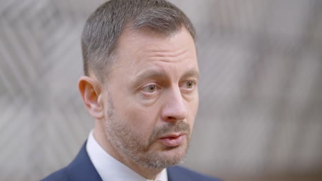 Prime-Minister-of-the-Slovak-Republic-Eduard-Heger-giving-an-interview-during-the-European-Council-summit-in-Brussels,-Belgium---Close-up-shot