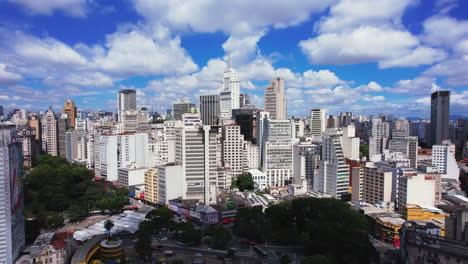 Aerial-view-around-the-skyline-of-sunny-Sao-Paulo,-Brazil---circling,-drone-shot