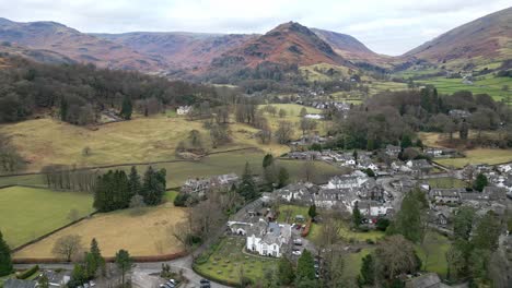 English-Lake-District-National-Park-landscape-cinematic-drone-aerial-video-footage-of-Grasmere-vlllage,-probably-Cumbria’s-most-popular-tourist-village