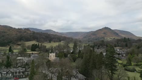 Lake-District-National-Park-cinematic-drone-aerial-video-footage-of-Grasmere-vlllage,-probably-Cumbria’s-most-popular-tourist-village