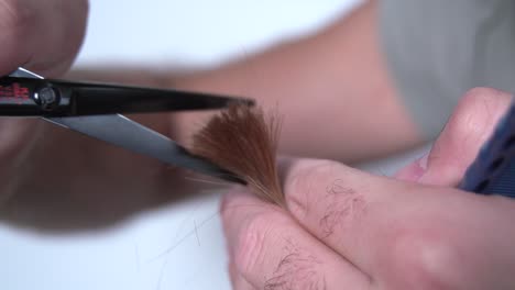 Barber's-Hands-Shears-to-cut--hair-in-hands