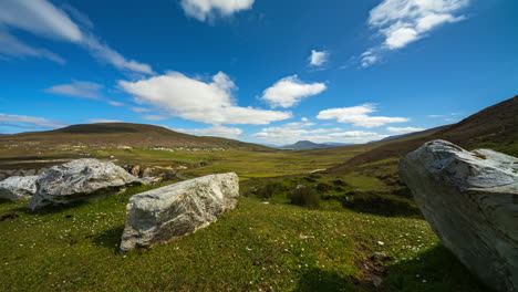 Timelapse-of-rocky-grass-landscape-with-moving-clouds-in-the-sky-on-sunny-day-in-Achill-Island-on-Wild-Atlantic-Way-in-Ireland