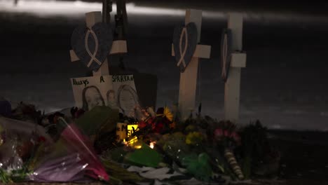 Michigan-State-University-Mass-shooting-memorial-at-the-Rock-with-markers-and-candles-editorial