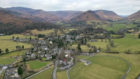 Cinematic-cumbrian-aerial-village-landscape,-Aerial-view-of-Grassmere,-village,-town-in-the-English-Lake-District,-UK