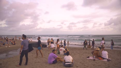 Crowds-gather-to-catch-the-sunset-every-evening-at-Batu-Bolong-beach-in-Bali-Canggu,-a-famous-destination-for-digital-nomads-around-the-world-looking-for-a-tropical-getaway-in-their-work-life-balance