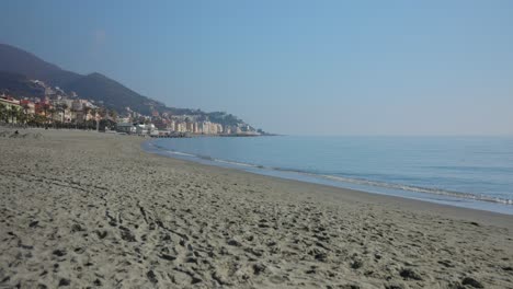 Calm-Ligurian-Sea-Waves-Break-Along-Beach-At-Varazze