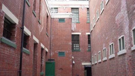 Pan-Up-View-From-Courtyard-At-Tai-Kwun-Showing-Red-Brickwork