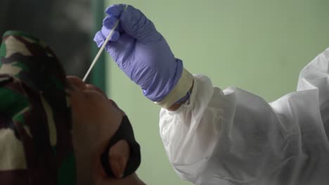 The-medical-staff-took-a-mucus-sample-to-be-examined-as-a-swab-test-method-related-to-corona