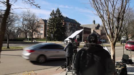 Media-along-Grand-River-Avenue-in-East-Lansing,-Michigan-the-day-after-the-mass-shooting-on-the-campus-of-Michigan-State-University-in-2023