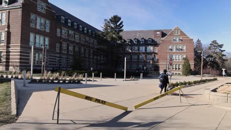 Berkey-Hall-on-the-campus-of-Michigan-State-University-with-a-police-barricades-and-stable-video