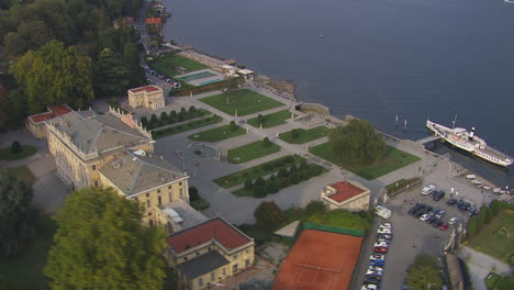 Aerial-rotating-shot-of-Villa-Olmo-with-a-spectacular-view-of-lake-Como-in-Italy
