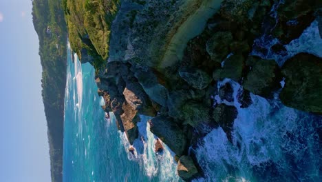 Aerial-vertical-shot-of-rocky-coastline-with-crashing-waves-during-sunset-time---CABO-FRANCES-VIEJO