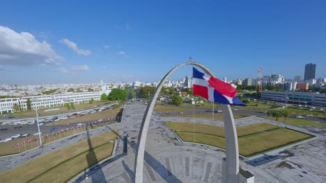 Spectacular-drone-flight-around-waving-Dominican-republic-flag-on-Memorial-in-Santo-Domingo