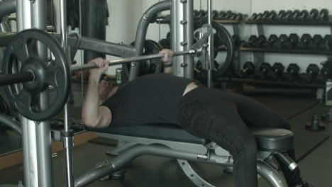 WIde-of-a-Young-Male-Using-a-Bench-Press-at-the-Gym