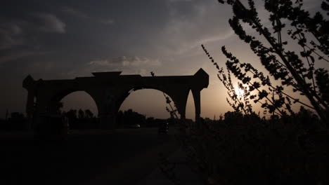 Archway-over-the-road-to-Jalingo,-Nigeria-Taraba-State-in-silhouette-at-sunset