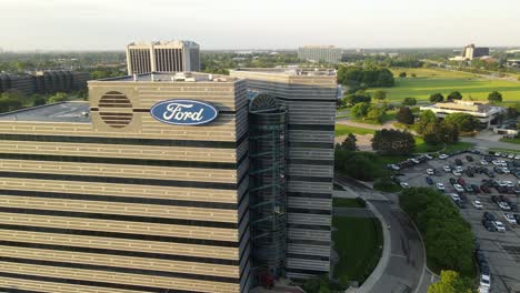 Ford-Regent-Court-building-on-sunny-bright-day,-aerial-ascend-view