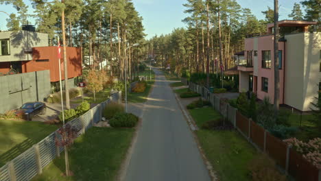 Modern-countryside-homes-in-the-forest---aerial-flyover