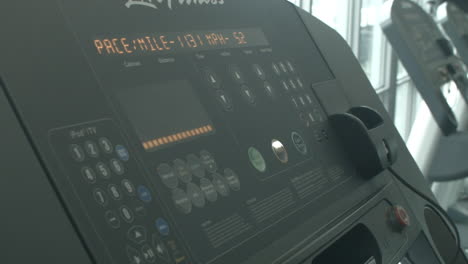 Close-Up-of-a-Man-Increasing-the-Speed-Level-on-a-Treadmill