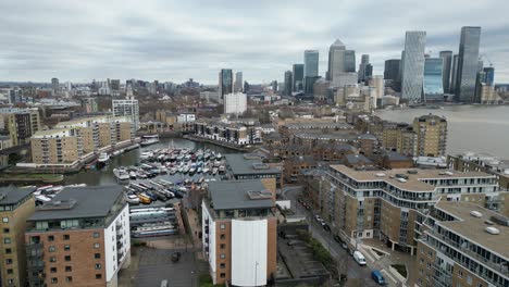 Panning-drone-aerial-Limehouse-basin-London-UK-Canary-Wharf-in-background