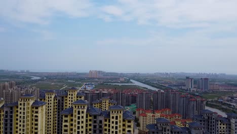 Flying-over-tall-Chinese-buildings---cinematic-aerial-view-of-rooftops