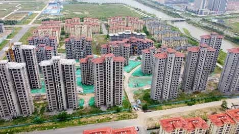 Cinematic-aerial-view-of-tall-Chinese-buildings-under-construction---China,-Nanhai-New-District