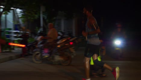 Happy-runner-during-Samui-Run,-being-cheered-and-applaud