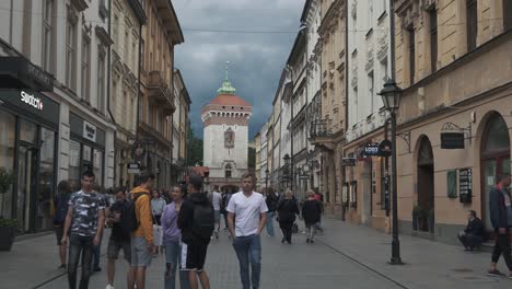 Krakow,-Poland---11-July-2022:-Tourists-on-Florianska-Street-Pov-Stedicam-Shot-Old-Town-of-Krakow,-Poland,-Historic-Center,-a-City-With-Ancient-Architecture