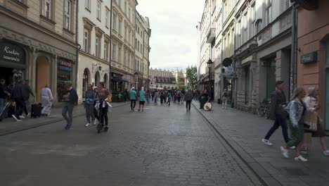 Krakow,-Poland---11-July-2022:-Tourists-Walking-at-Grodzka-Street-Old-Town-of-Krakow,-Poland,-Historic-Center-a-City-With-Ancient-Architecture