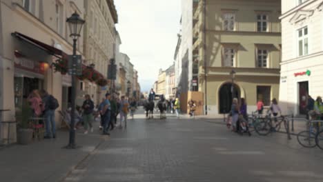 Krakow,-Poland---11-July-2022:-Tourists-Walking-at-Grodzka-Street-Old-Town-of-Krakow,-Poland,-Historic-Center-a-City-With-Ancient-Architecture