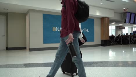 Passengers-inside-a-half-empty-Nashville-international-airport-terminal