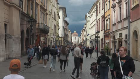 Krakow,-Poland---11-July-2022:-Tourists-on-Florianska-Street-Pov-Stedicam-Shot-Old-Town-of-Krakow,-Poland,-Historic-Center,-a-City-With-Ancient-Architecture